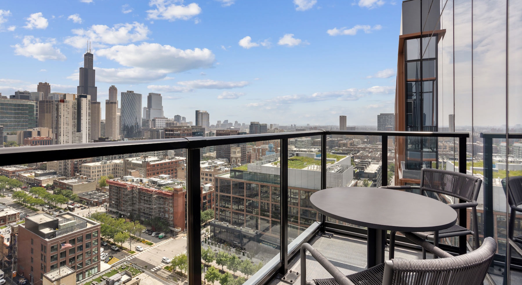 Spacious balcony with a city view 