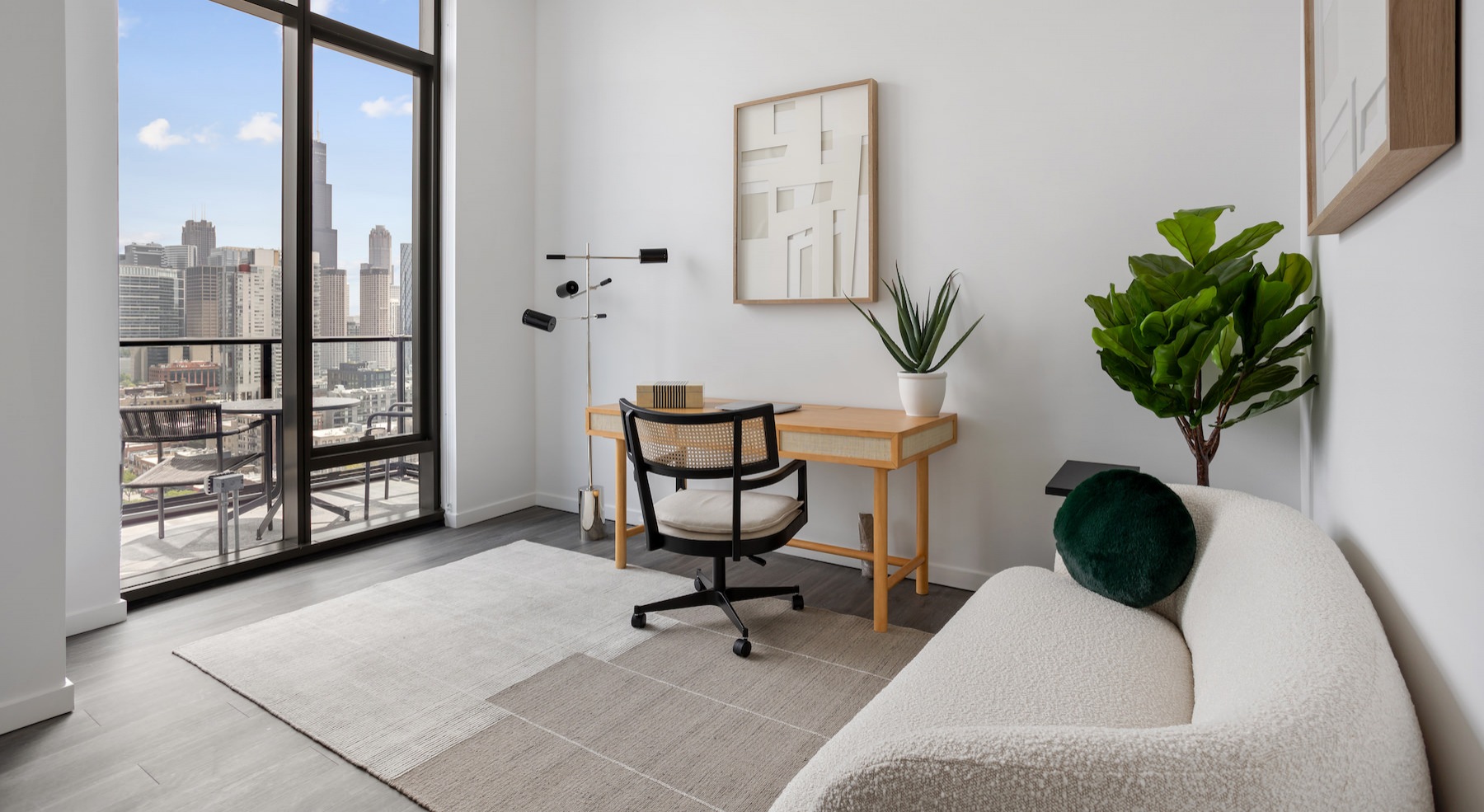 Room with a large couch and large window